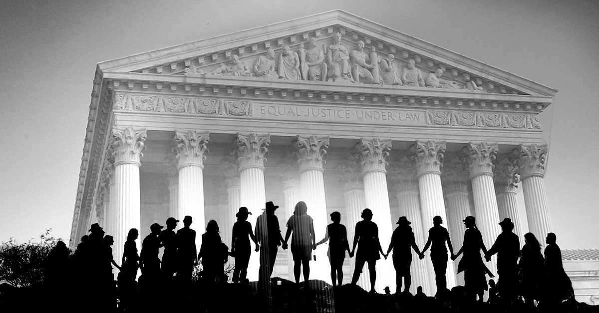 people holding hands in front of supreme court