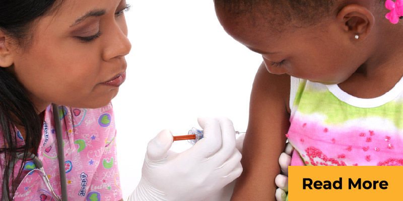 Nurse giving girl a shot