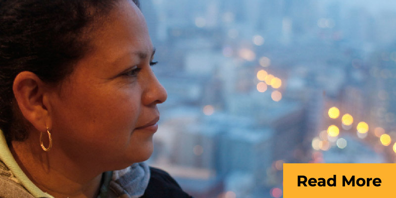 Woman looking out over city