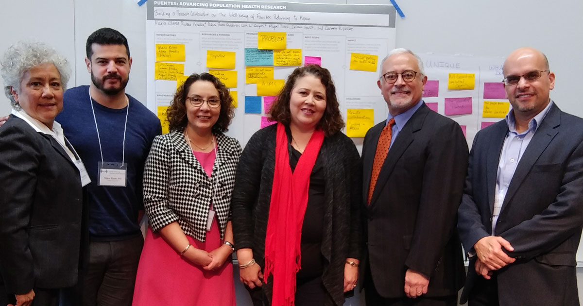 Deliana Garcia standing next to five members of the migrant health team