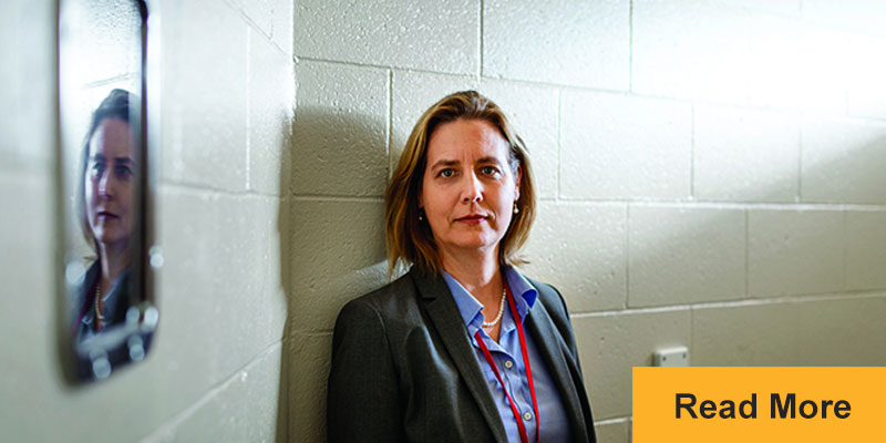 Jennifer Clarke standing in holding cell