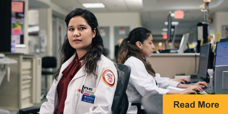 Rosa Aramburo at computer desk in medical center