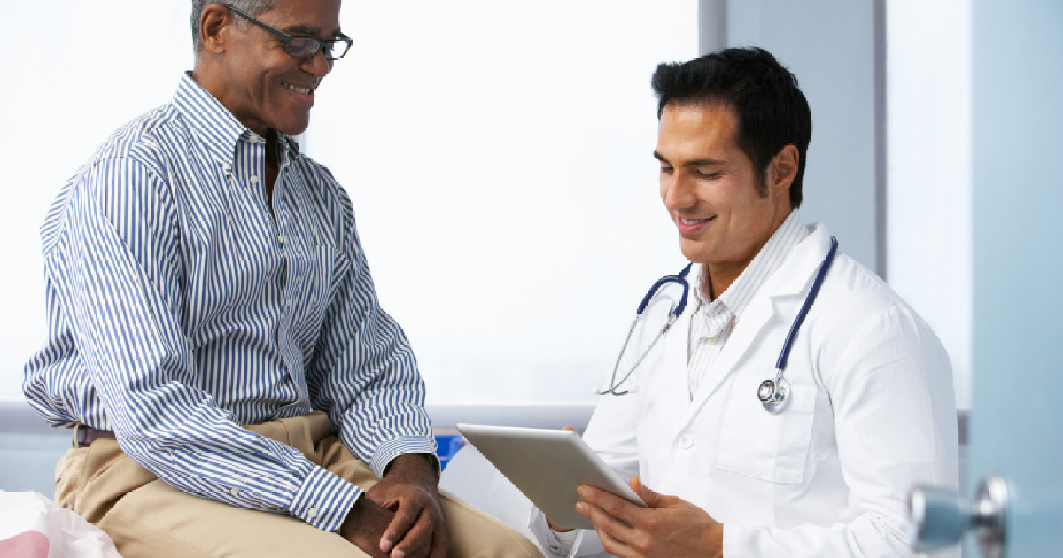 A patient talks with his doctor