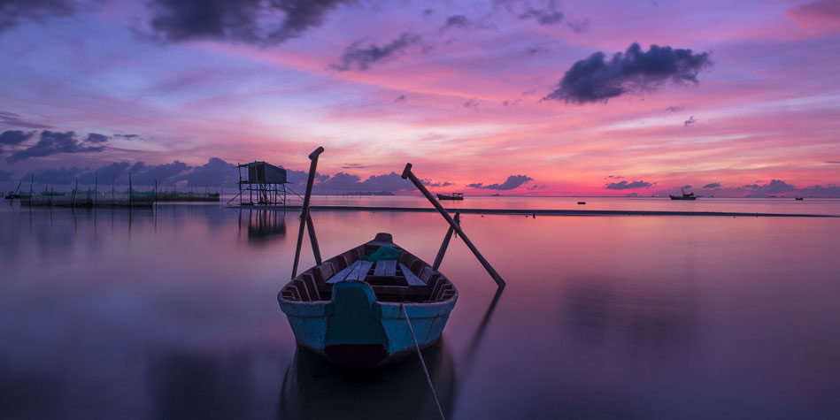 boat on the water at sunset