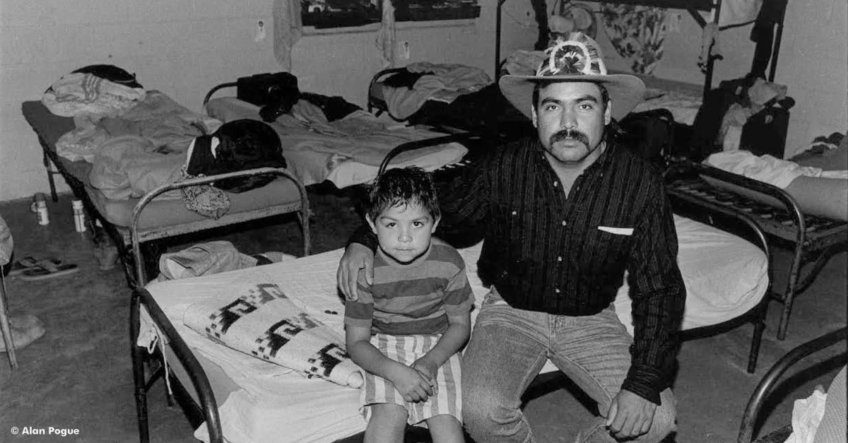 migrant and son in poor housing