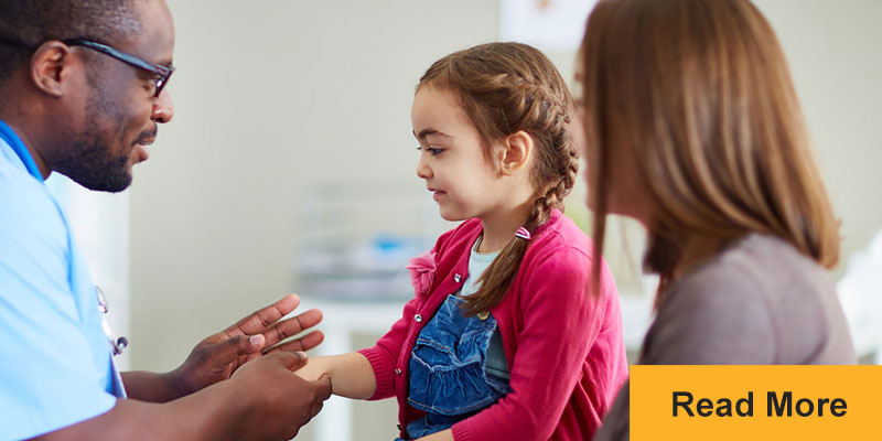 Doctor with child in clinic