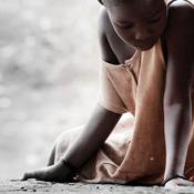 sick girl sitting on ground