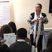 MCN's Alma Galván speaking in Puerto Rico to a group