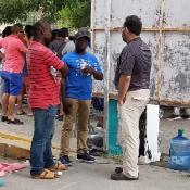 MCN Chief Medical Officer Laszlo Madaras speaking with asylum seekers.