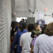 People waiting in line at detention center