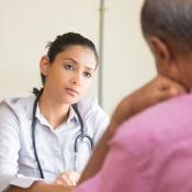 Clinician talks with patient