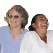 Candace Kugel laughs with a storekeeper in Honduras