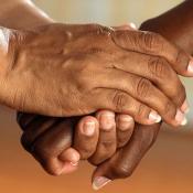 Woman holding hand comforting