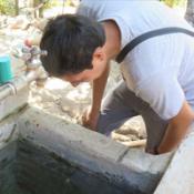 Clinician inspecting water source