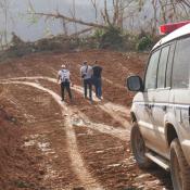 Cars driving on hurricane beaten dirt roads