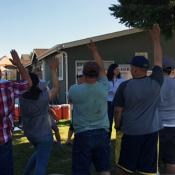 workers raising hands