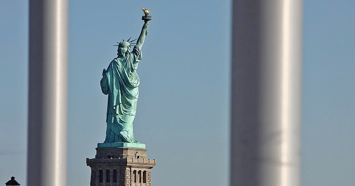 statue of liberty behind bars