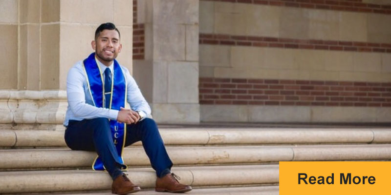 man sitting on university steps