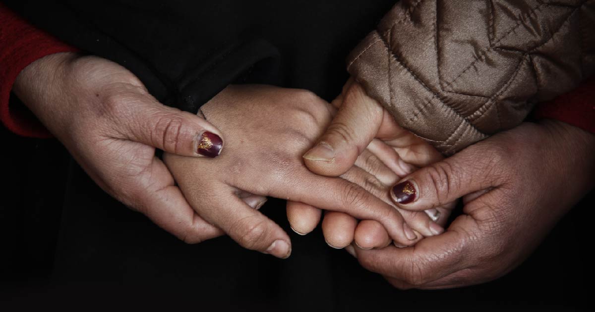 A family holding hands