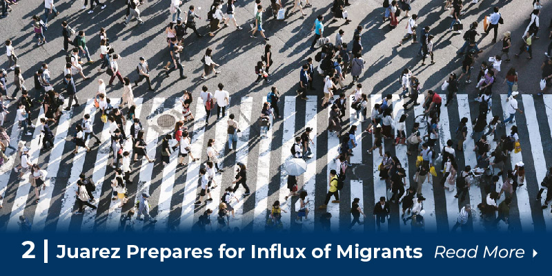 A crowd of people crossing the street