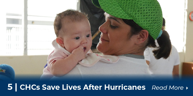 Puerto Rican aid worker holds baby