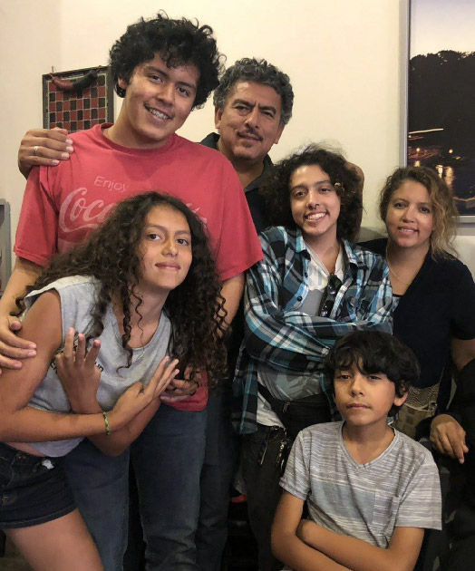 The Rodriguez family. Front row: Liliana, 13, and Alejandro, 10. Back row: Adrian,15; Jose, father; Izaak, 18; and Carmen, mother.