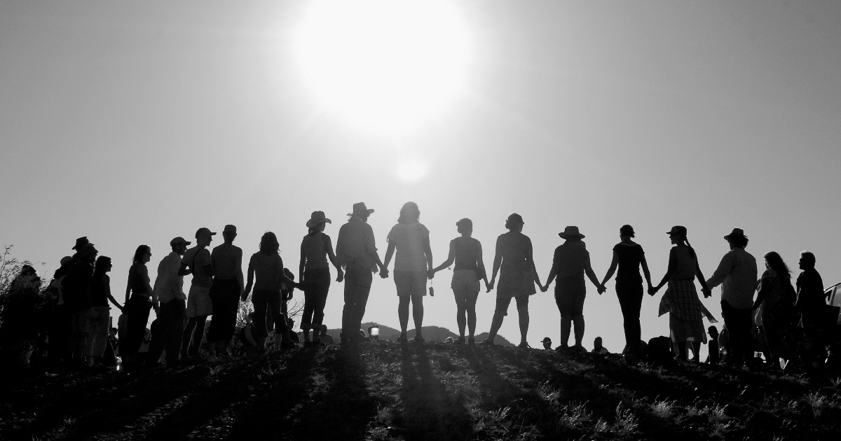 People standing together on hillside