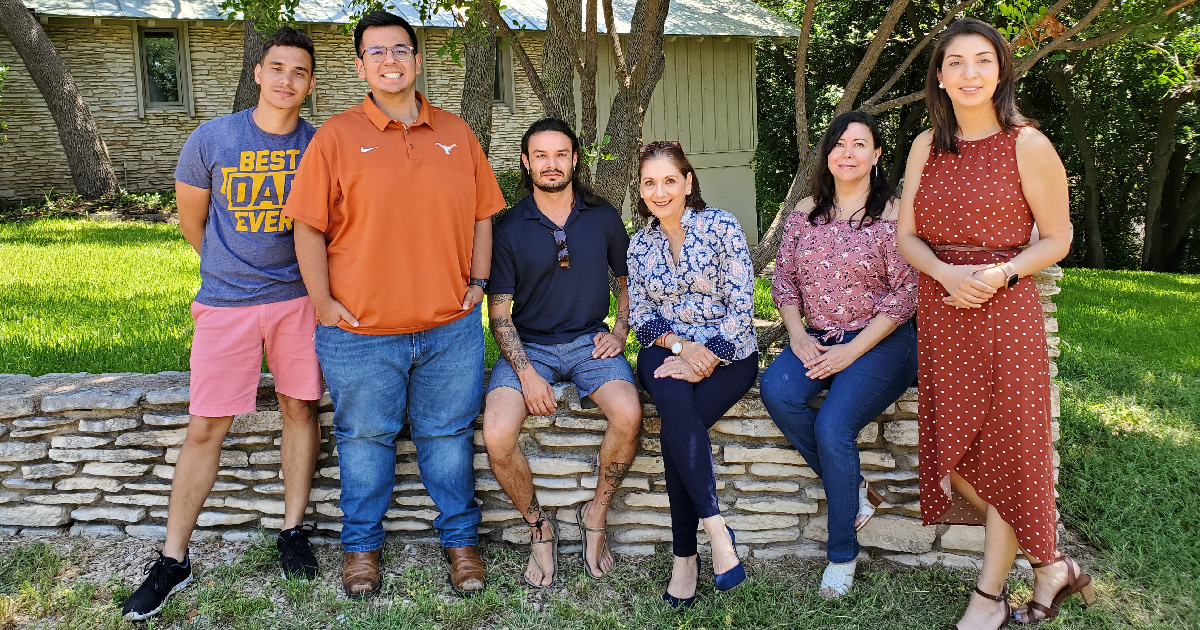 Nelly Salgado poses for photo with MCN's Health Network team outside the MCN office in Austin, Texas.