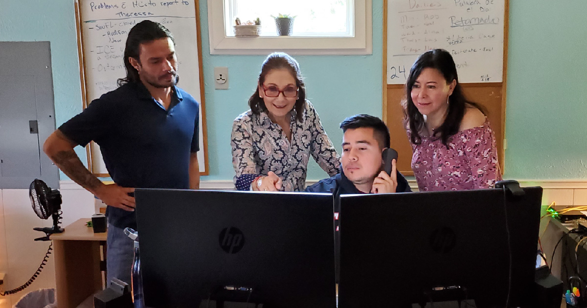 Nelly Salgado works with Health Network Associates Robert Corona and Nestor Reyes, and Ventanilla de Salud Coordinator Roxana Pineda