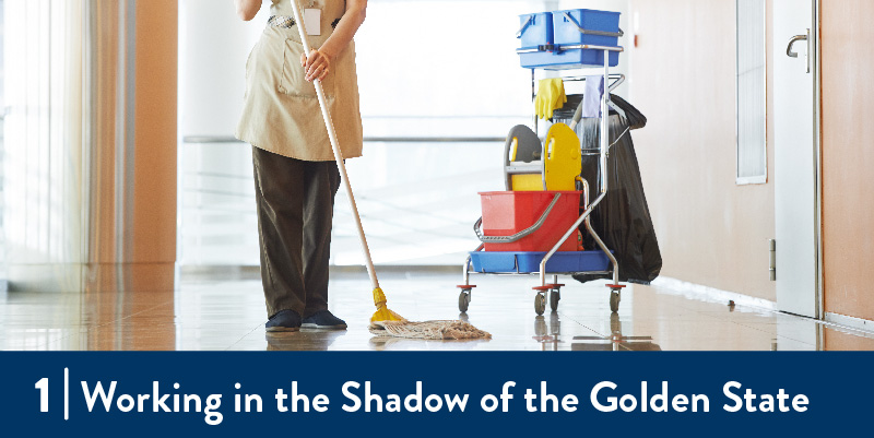 A woman works cleaning the floors