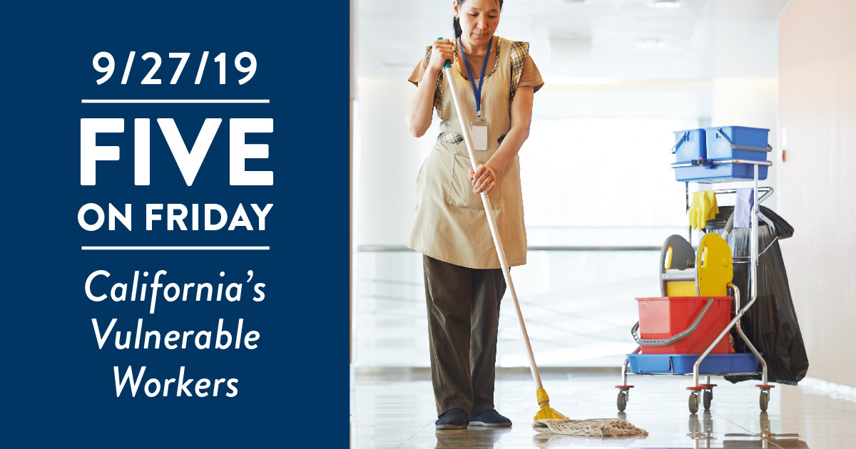 A woman works cleaning the floors