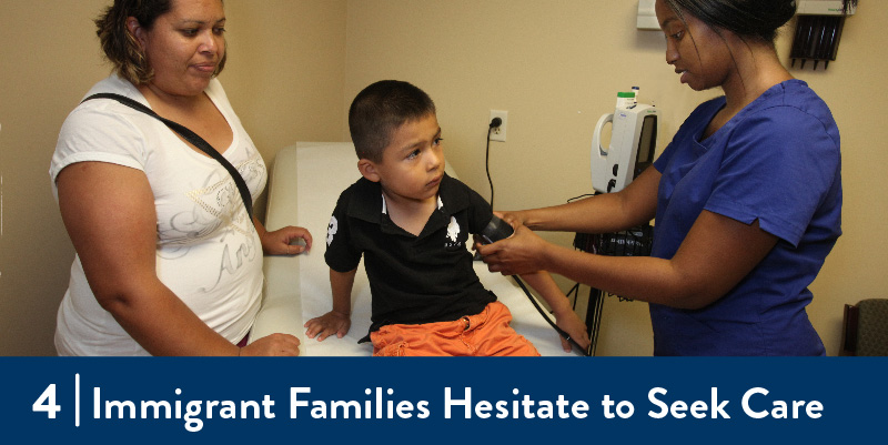 A boy and his mother receiving care from a clinician