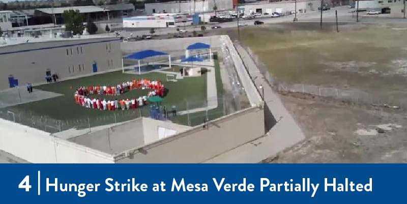 Detainees form a heart in the yard of the facility.