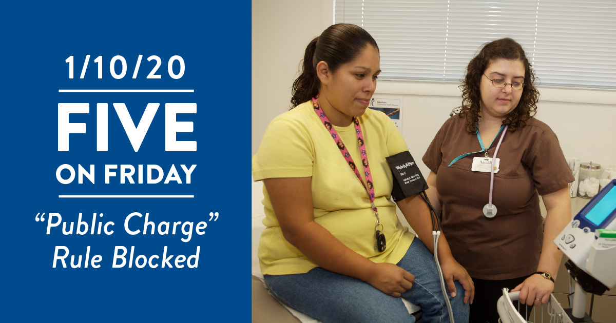 A clinician checks someone's blood pressure