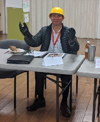 A training attendee wears PPE as part of a demonstration