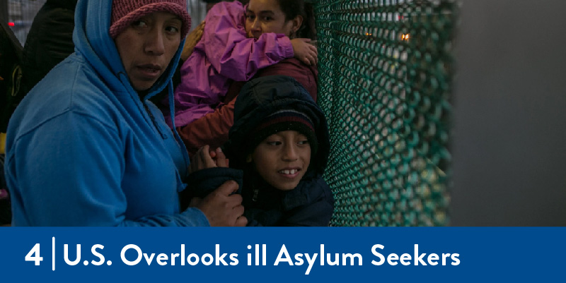 A mother with her son waiting to cross into the U.S.