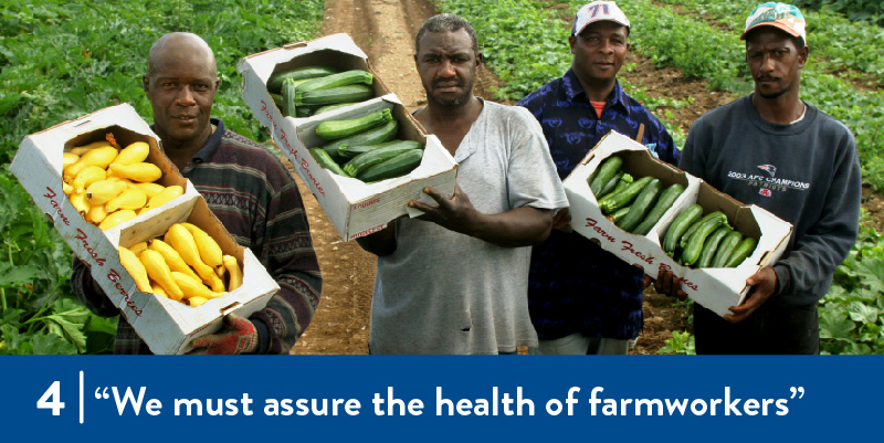 farmworkers show the produce they've harvested