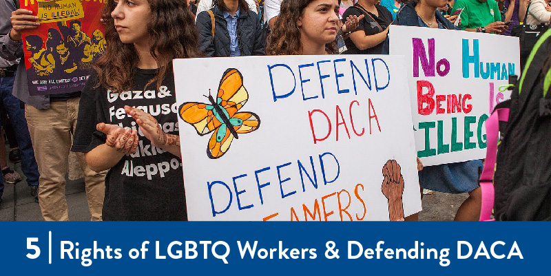 Protesters with signs in support of DACA