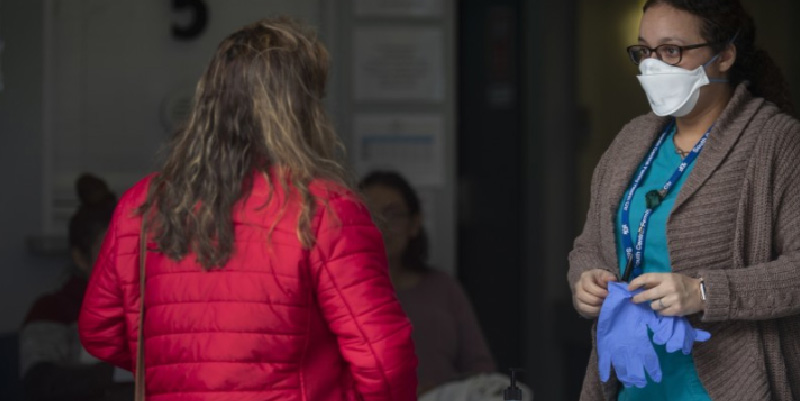 A woman talking with a clinician