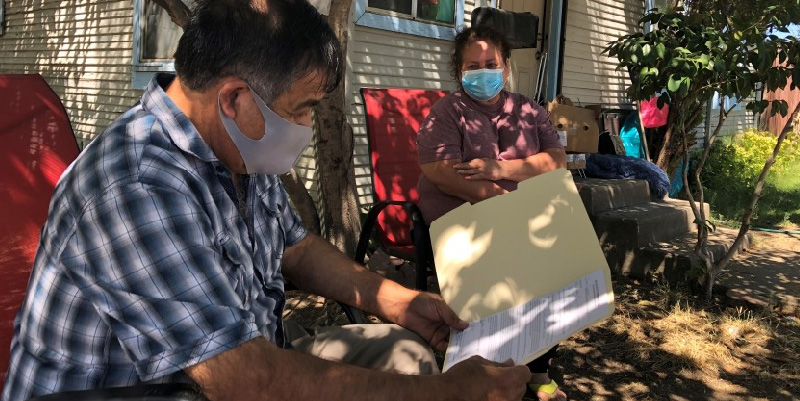 essential workers looking at paperwork