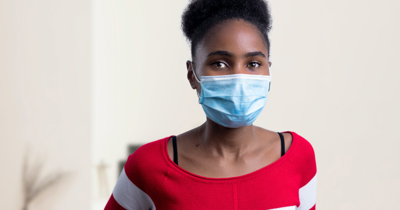 A photo of a woman in a face mask