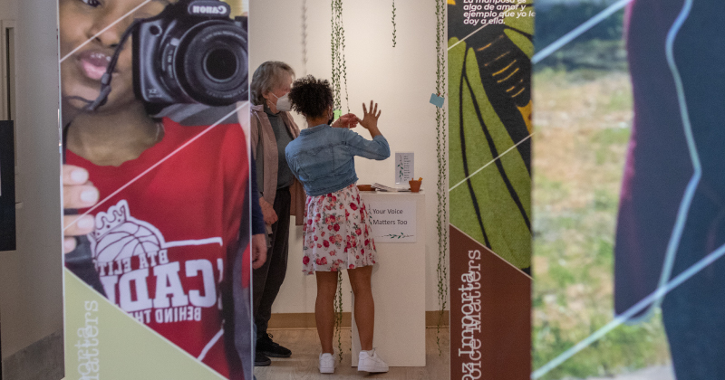 Attendees at the Photovoice Exhibit