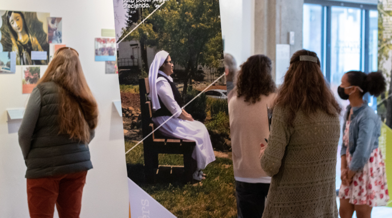 Attendees at the Photovoice Exhibit