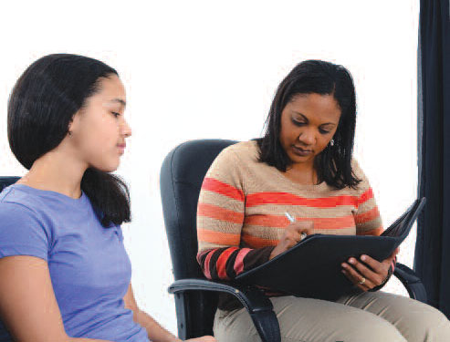 Researcher interviewing patient